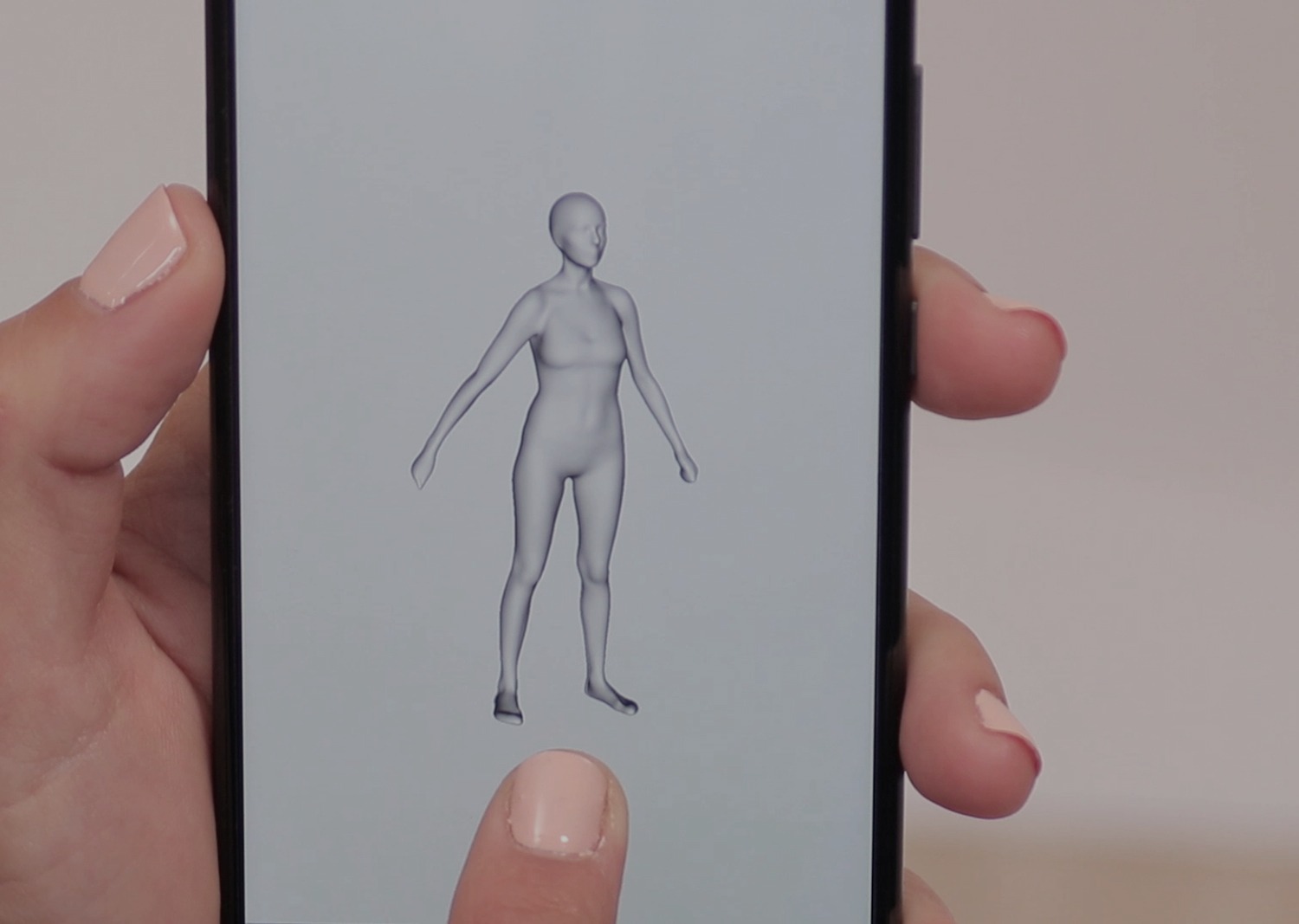 Fotografía de la pantalla de teléfono móvil con el escaneo de una figura humana con Avatar Body