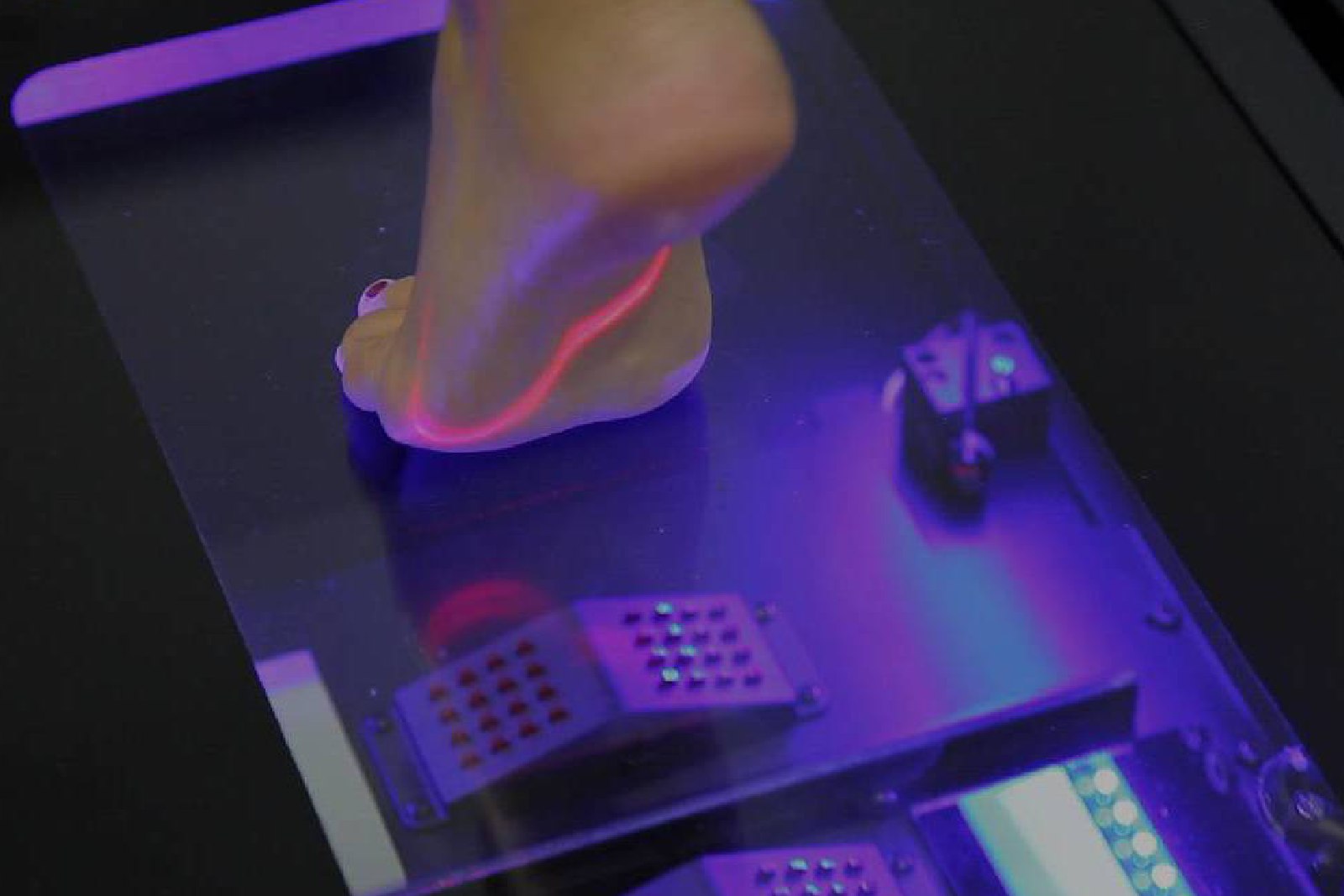 Foot stepping on a scanner for a scanning process