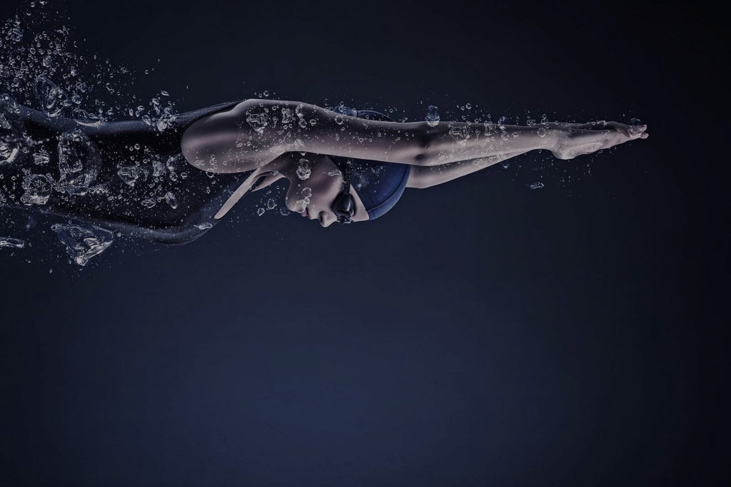 A woman swimming under water