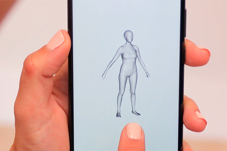 Fotografía de un teléfono móvil mostrando el resultado en 3D de una figura humana